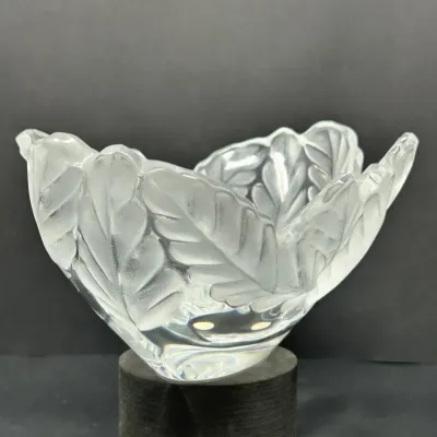 Sale Photo Thumbnail #36: Lalique-style frosted and clear crystal leaf bowl featuring embossed botanical details on a heavy glass base.