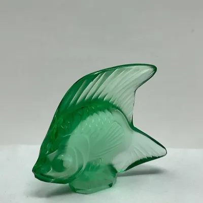 Sale Photo Thumbnail #102: Lalique-style molded green glass fish figurine, featuring frosted and clear detailing in an Art Deco design.