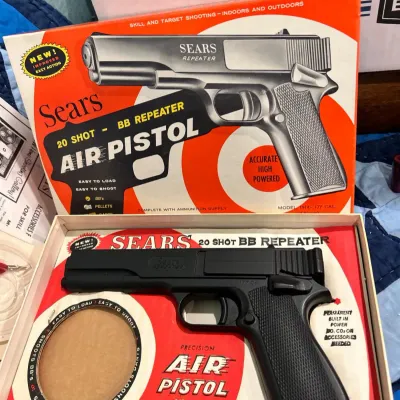 Sale Photo Thumbnail #198: Vintage Sears 20 Shot BB Repeater Air Pistol, model 1914, complete with its original illustrated box and packaging insert.