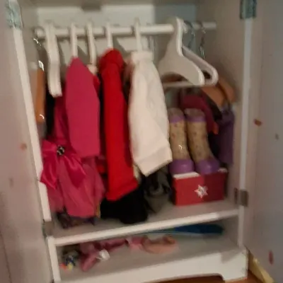 Sale Photo Thumbnail #6: American Girl doll wardrobe closet filled with clothing, hangers, boots, and accessories.