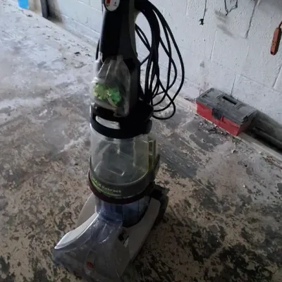 Sale Photo Thumbnail #163: Hoover Max Extract upright carpet cleaner with clear water tanks and power cord attached.