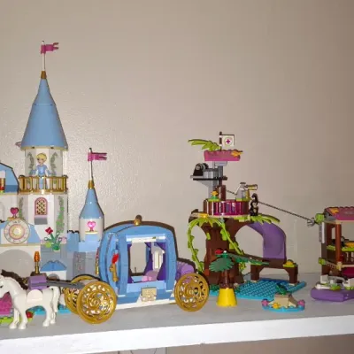 Sale Photo Thumbnail #128: Collection of assembled LEGO Disney Princess and Friends playsets, including Cinderella's Romantic Castle, horse-drawn carriage, and jungle rescue base.