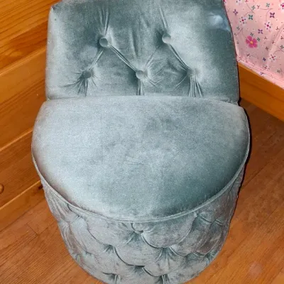 Sale Photo Thumbnail #3: Vintage-style vanity chair upholstered in dusty blue velvet with diamond-tufted detailing along the back and base.