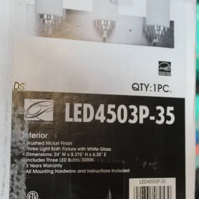 Cordelia Lighting three-light bath fixture in brushed nickel finish with white glass shades, new in original packaging.