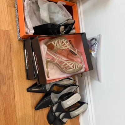 Sale Photo Thumbnail #106: Collection of women's dress shoes, including gold glitter Nina strappy heels in box, black BCBGMAXAZRIA studded slingbacks, and San Marino heels.
