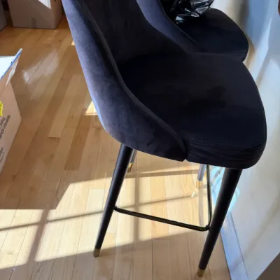 Sale Photo Thumbnail #34: Contemporary counter-height bar stool upholstered in dark grey velvet with tapered black metal legs and brass-tone feet.