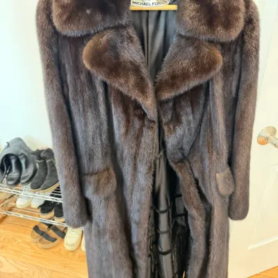 Sale Photo Thumbnail #87: Vintage Pierre Cardin dark brown mink fur coat with wide notch lapels and a dark silk lining.