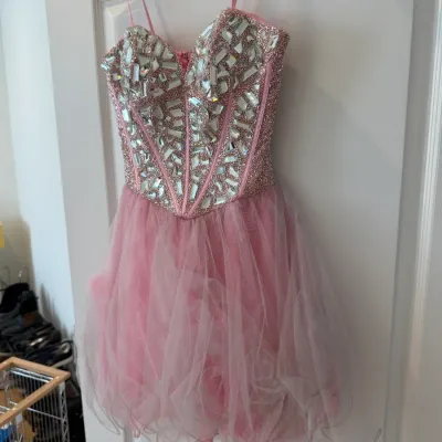 Sale Photo Thumbnail #54: Pink party or prom dress featuring a crystal-embellished corset bodice and a tiered tulle skirt.