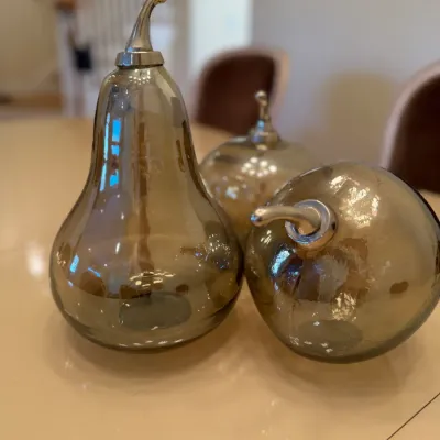 Sale Photo Thumbnail #20: Set of three smoked blown glass fruit-shaped decorative tabletop objects, including a pear and two apples, each featuring a silver-tone stem.