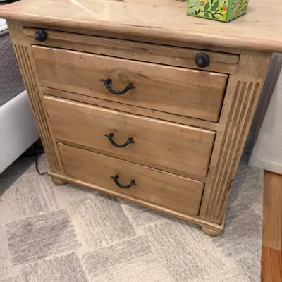 Sale Photo Thumbnail #62: Light pine three-drawer nightstand featuring a pull-out tray slide, fluted side details, and dark iron hardware.