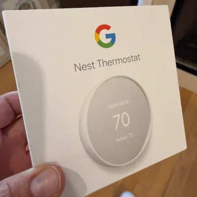 Sale Photo Thumbnail #21: Google Nest Thermostat in its original retail packaging.