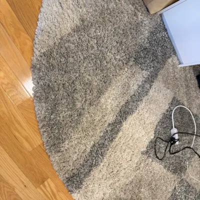 Sale Photo Thumbnail #41: Round modern shag area rug featuring a geometric block pattern in shades of grey, cream, and charcoal.