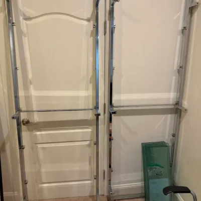 Sale Photo Thumbnail #51: Disassembled modern chrome shelving unit frames paired with a stack of green-tinted tempered glass shelves and mounting hardware.