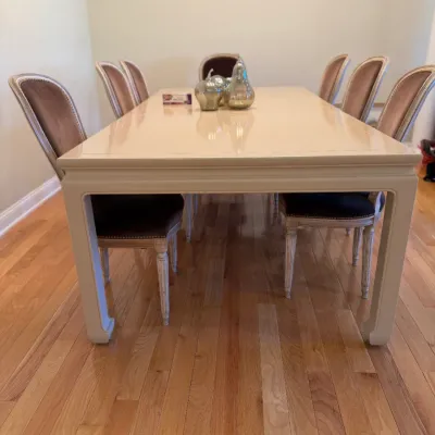 Sale Photo Thumbnail #18: Off-white lacquer dining table paired with French Neoclassical style dining chairs featuring upholstered backrests and seat cushions with nailhead trim.