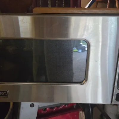 Sale Photo Thumbnail #10: Viking Professional stainless steel countertop microwave oven showing light surface wear.