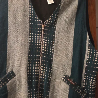 Sale Photo Thumbnail #67: Vintage 1990s Rip Curl zip-up woven vest in a size medium, featuring a striped and patterned fabric design in teal, gray, and black.