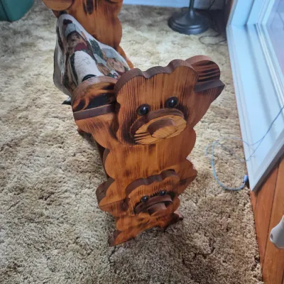 Sale Photo Thumbnail #75: Rustic wooden quilt or blanket rack featuring carved teddy bear sides with a burnt-wood finish.