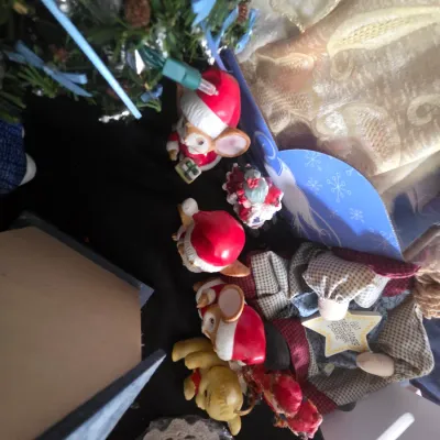 Sale Photo Thumbnail #25: Collection of Christmas decorations including festive mouse figurines, a cloth angel, and small ornaments.