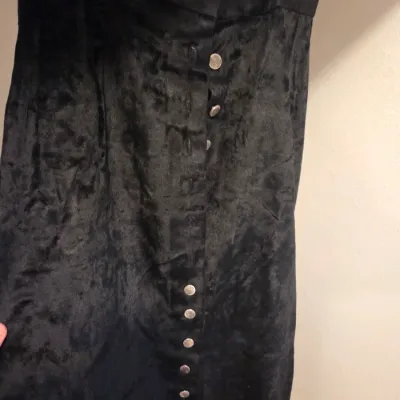 Sale Photo Thumbnail #138: Vintage black crushed velvet maxi skirt featuring a button-down front with round metal buttons.