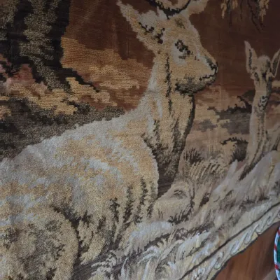 Sale Photo Thumbnail #157: Vintage woven velour tapestry featuring a forest scene with stags in earthy brown and beige tones.