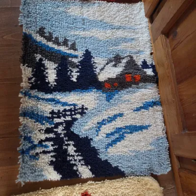 Sale Photo Thumbnail #155: Handmade vintage latch-hook yarn rug depicting a snowy cabin and evergreen trees landscape scene.