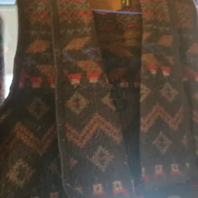 Sale Photo Thumbnail #62: Southwestern-style patterned wool vest featuring geometric designs in earth tones and decorative metal buttons.