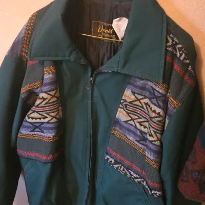 Sale Photo Thumbnail #63: Vintage Davis James forest green bomber jacket with Aztec Southwestern pattern woven accents, featuring a quilted lining and full zip closure.