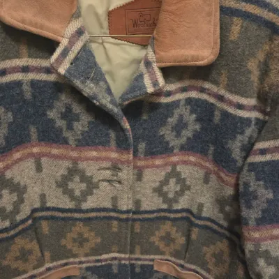Sale Photo Thumbnail #65: Vintage Woolrich heavy wool jacket featuring a Southwestern geometric pattern with a suede collar and trim.