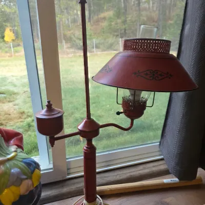 Sale Photo Thumbnail #148: Vintage rust-red metal student desk lamp featuring an offset arm, glass hurricane shade, and painted scroll detailing.