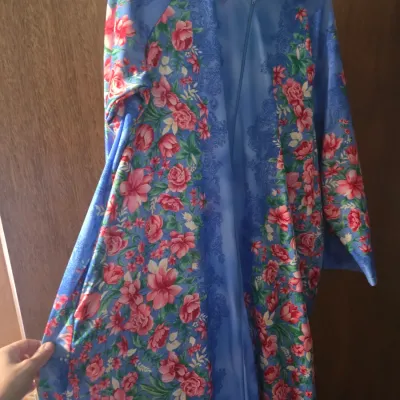 Sale Photo Thumbnail #147: Vintage Anthony Richards full-length housecoat or robe featuring a vibrant pink and red floral print on periwinkle blue satin with a front zipper closure.