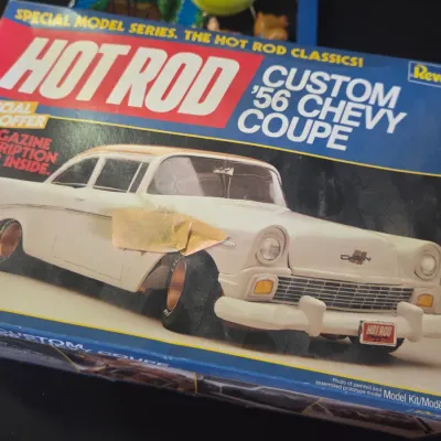 Sale Photo Thumbnail #42: Vintage Revell Hot Rod Custom '56 Chevy Coupe model kit in original box, showing light shelf wear and masking tape on the front cover.