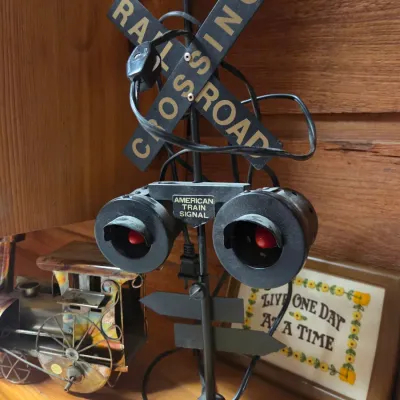 Sale Photo Thumbnail #152: Vintage American Train Signal electric railroad crossing table lamp with crossbuck sign and dual red light housings.
