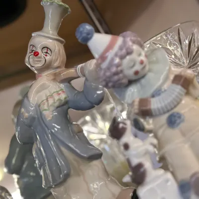 Sale Photo Thumbnail #37: Pair of vintage hand-painted porcelain clown figurines, including a standing clown in a top hat and a sleeping clown with an accordion.