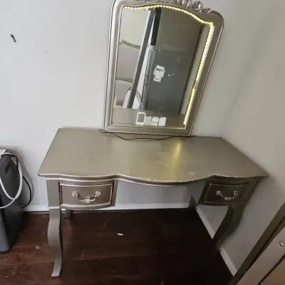 Vanity With Mirror And A Chair