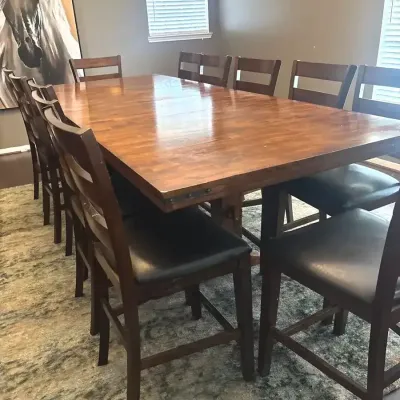 Table With 3 Leaves And 12 Chairs And A Rug