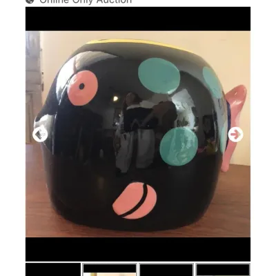 Sale Photo Thumbnail #51: Whimsical black ceramic fish-shaped tissue box cover featuring colorful polka dots and a glossy finish.