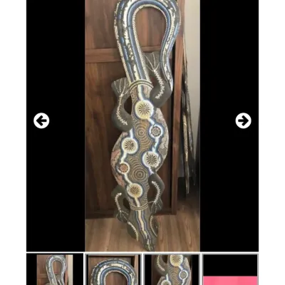 Sale Photo Thumbnail #65: Large wooden lizard sculpture featuring intricate Aboriginal-style dot painting artwork.