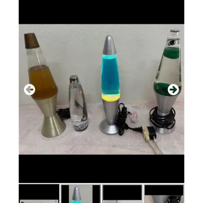 Sale Photo Thumbnail #31: Collection of four modern lava-style novelty lamps in varying colors and metallic bases.