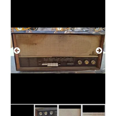 Sale Photo Thumbnail #83: Vintage Grundig tabletop tube radio in a dark wood cabinet, featuring multi-band tuning and cream-colored push buttons.