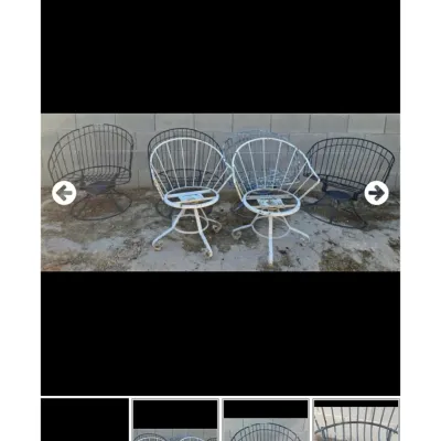 Sale Photo Thumbnail #33: Set of vintage wrought iron patio swivel chairs in black and distressed white paint, showing surface rust and wear.