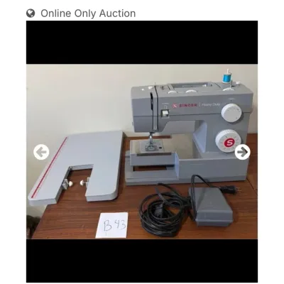 Sale Photo Thumbnail #50: Gray Singer Heavy Duty portable sewing machine with extension table, foot pedal, and power cord.