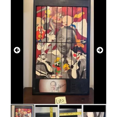 Sale Photo Thumbnail #99: Vintage Mel Blanc Looney Tunes tri-ocular motion art display piece housed in a black frame with a small signed portrait inset.