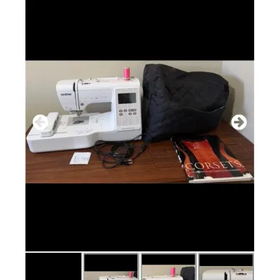 Sale Photo Thumbnail #44: Brother computerized embroidery and sewing machine with power cord, black quilted dust cover, and a Corsets historical pattern book.