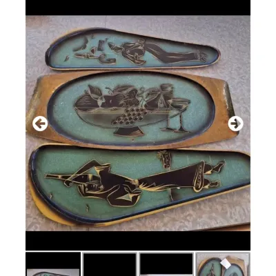 Sale Photo Thumbnail #34: Set of three mid-century modern ceramic wall plaques featuring stylized figures and a fruit still life, styled with teal crackle glaze and black silhouettes.