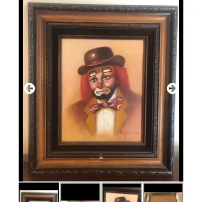 Framed vintage clown portrait painting signed Hoppin, set in an ornate carved wooden and black inner frame.