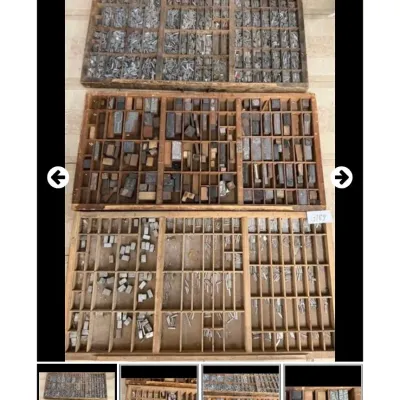 Sale Photo Thumbnail #103: Set of three vintage wooden printer's drawers filled with metal and wood letterpress type blocks.
