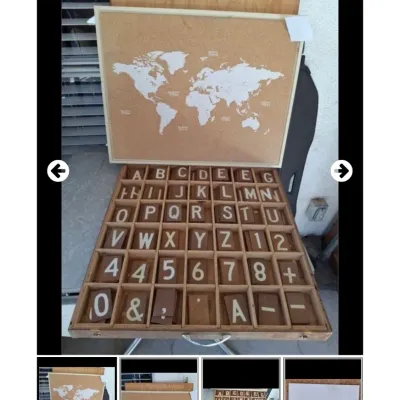 Sale Photo Thumbnail #72: Framed corkboard featuring a printed white world map alongside a compartmentalized wooden tray containing interchangeable letter and number tiles.