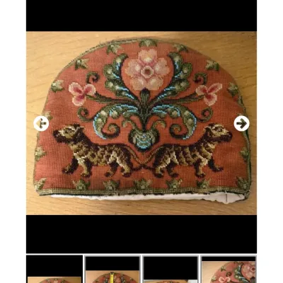 Sale Photo Thumbnail #32: Vintage needlepoint tea cozy featuring a floral and leopard design on a terra cotta background with white inner lining.
