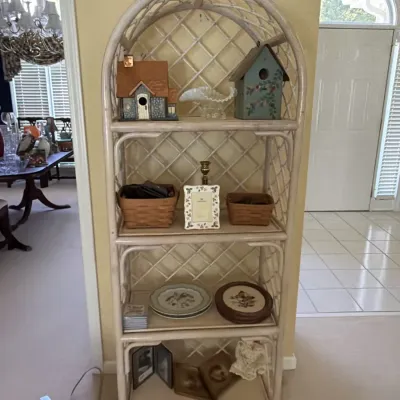 Sale Photo Thumbnail #22: Whitewashed rattan arched etagere with Longaberger baskets, a Wedgwood Wild Strawberry frame, opalescent glass and decorative birdhouses