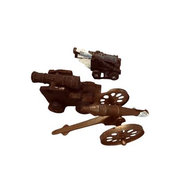 Set of three vintage miniature metal and cast iron cannons, featuring detailed carriages and spoked wheels.
